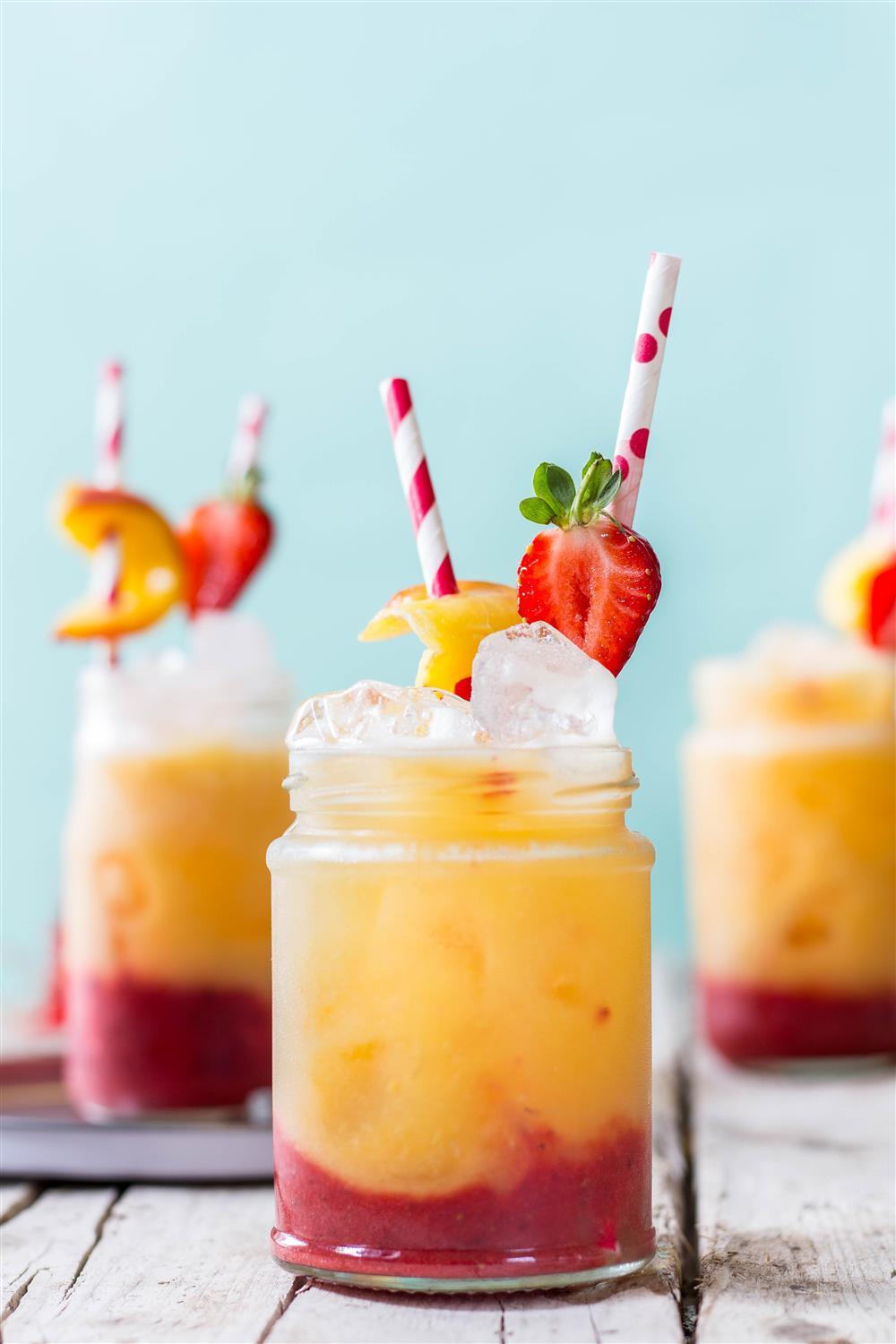 Delightful spring mocktail - roasted peach and strawberry fizz with no added sugar. Click to find the whole recipe or pin and save for later!
