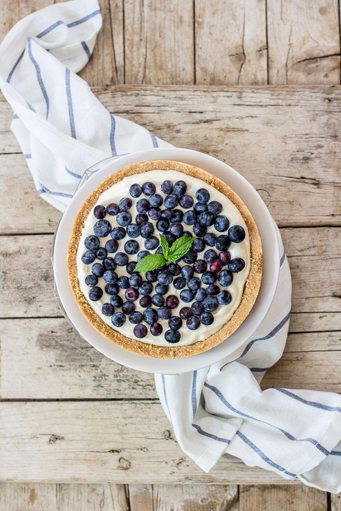 What better way to enjoy summer but with this melt in your mouth no-bake blueberry cheesecake with a cookie crust. Click to find the whole recipe or pin and save for later!