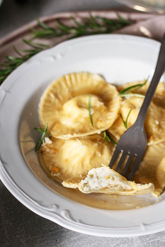 These humble but exciting pecorino ravioli with orange zest and brown butter flavored with rosemary will bring any dinner to a new level!