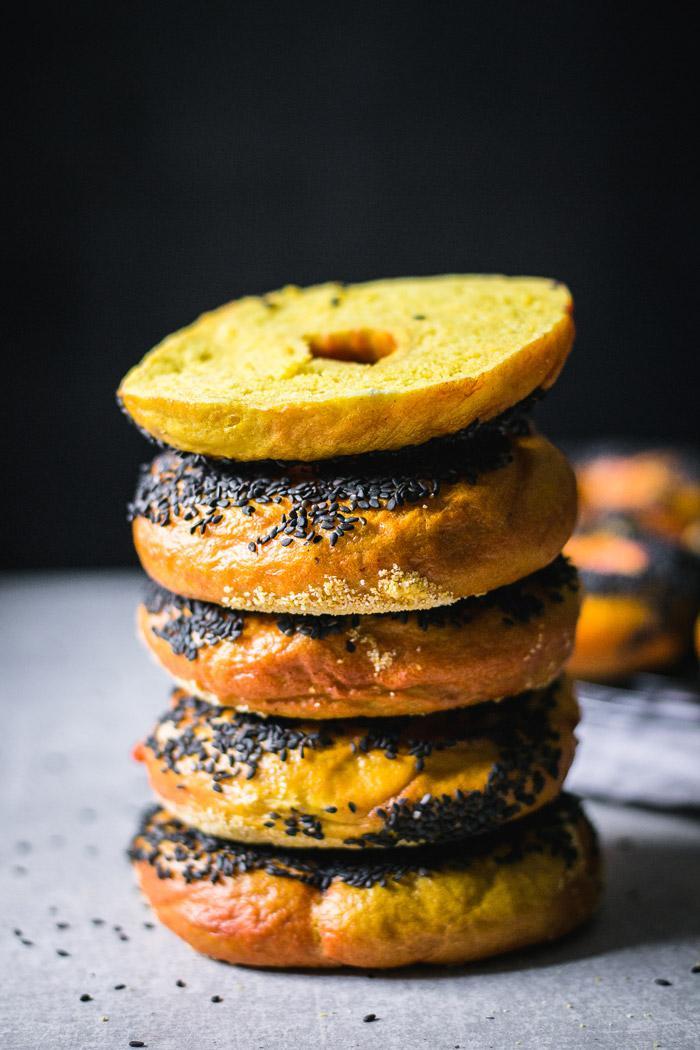The softest low-fat black sesame covered chewy turmeric bagels that are ridiculously tasty and a great basis for a breakfast sandwich.