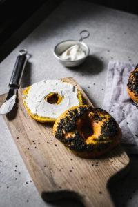 The softest low-fat black sesame covered chewy turmeric bagels that are ridiculously tasty and a great basis for a breakfast sandwich.