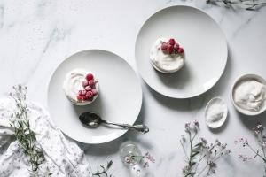 These no-bake frozen coconut cakes with sweet creamed coconut and Greek yogurt on top of a no-bake almond crust are the perfect summer desserts. Add some whipped cream and seasonal berries and you're in it for a win!