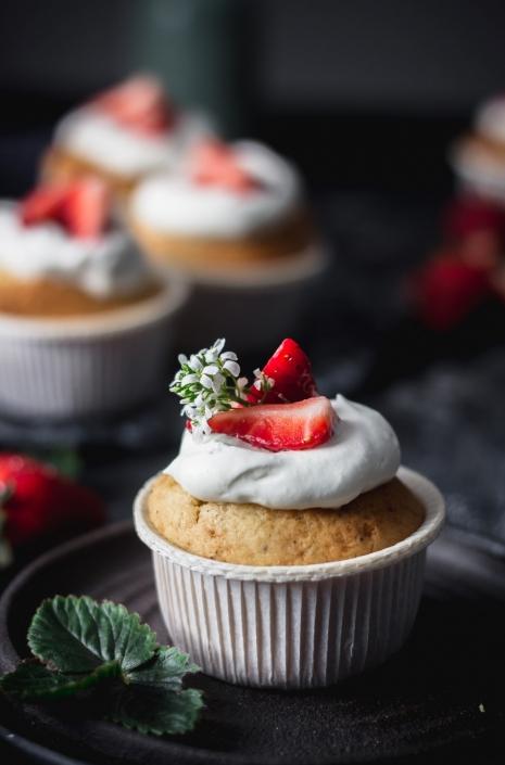 Strawberry yogurt cupcakes with whipped cream frosting and balsamic strawberries. One bite of these and you will agree, these are the best!