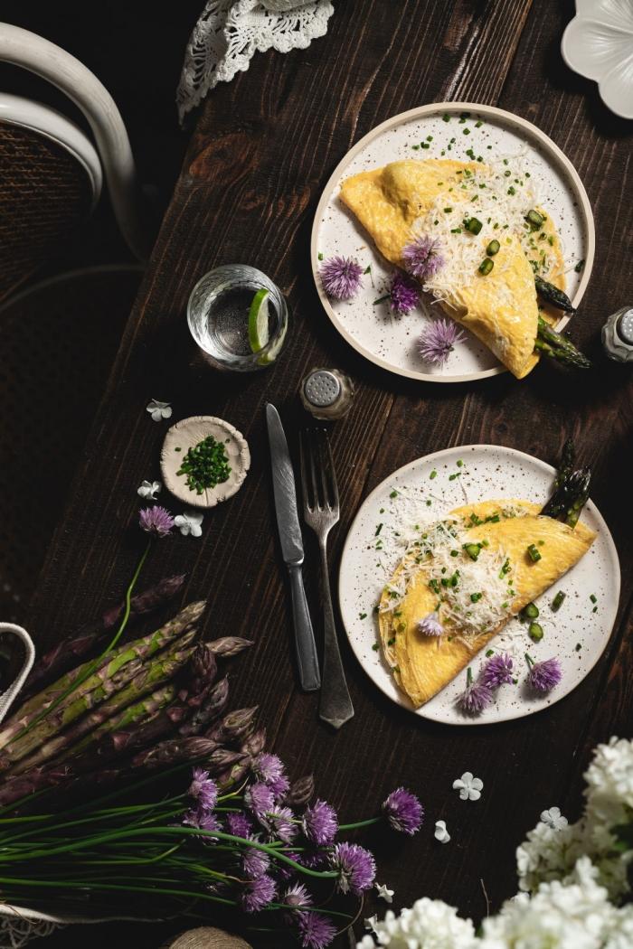 Perfect savory breakfast - soft and creamy asparagus omelet with parmesan cheese and some fresh chives. What could be better?