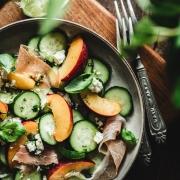 This refreshing Cucumber and peach salad is the perfect intro to Summer! With some prosciutto, feta cheese, and spicy basil dressing it's a winner!