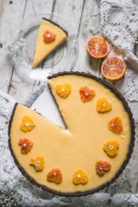 One of the best flavor pairings - dried figs and orange in a perfect Valentine's day dessert - a decadent dried fig and blood orange tart. Simple chocolate tart crust is holding a dried fig jam and a zesty blood orange curd, which is decorated with tiny orange hearts. What a treat!