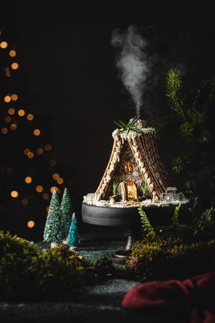 Prepare to dazzle your guests with this savory gingerbread house shaped as a holiday cabin. Add it to your charcuterie board and it will be a perfect match!