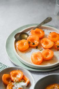 A light Summer dessert with ton of flavor - honey poached apricots. This soft and tender desserts melts in your mouth.