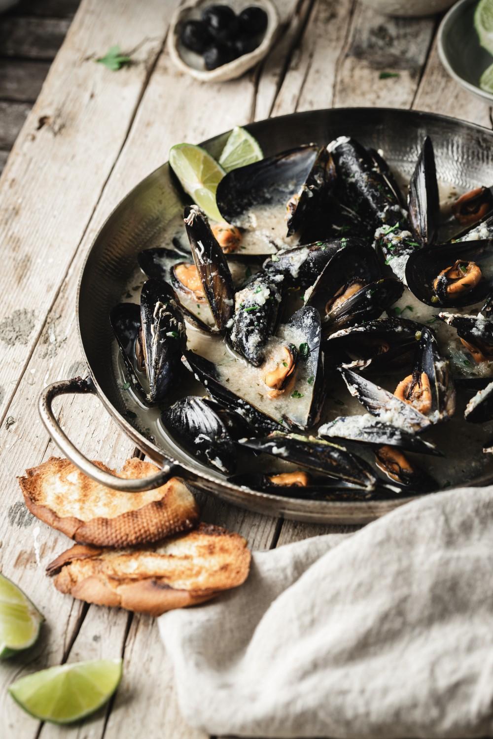 This mussels recipe is the easiest and super delicious! With just a few simple ingredients you get maximum flavors. Wine, garlic, and parsley make the most delicious sauce.