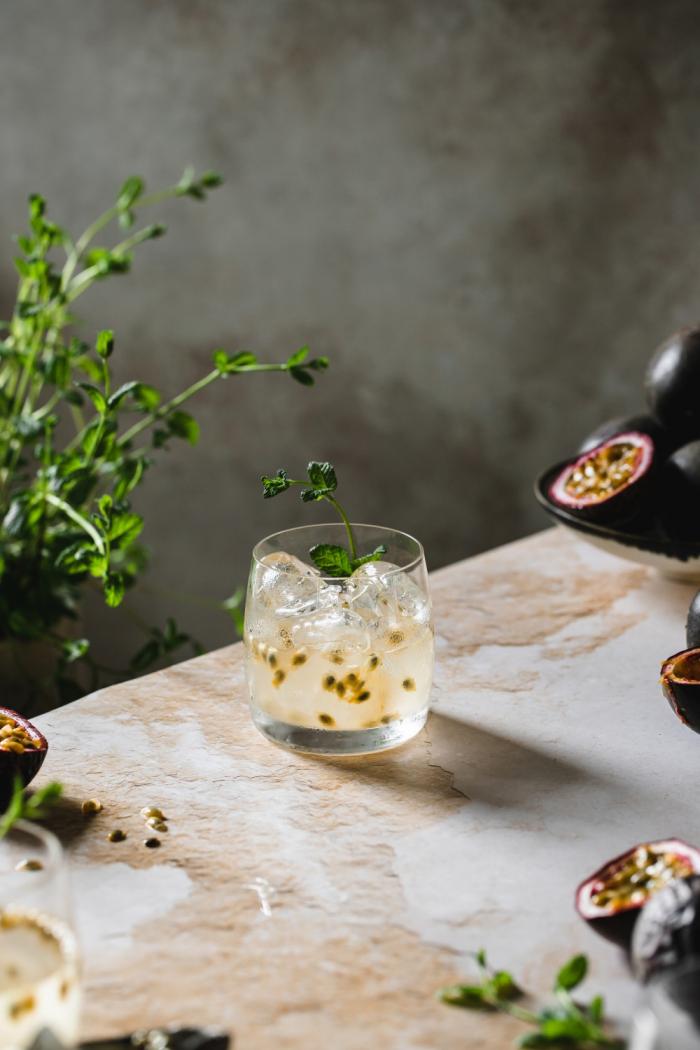 Fresh passion fruit and delicious floral elderflower syrup give this refreshing elderflower and passion fruit gin and tonic recipe a sweet valentine's day twist.