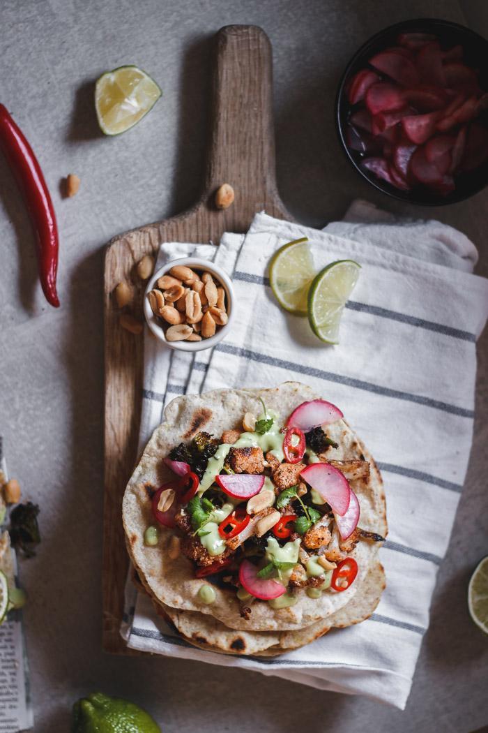 These quick and easy roasted broccoli and cauliflower mole tacos are such a nice healthy fresh lunch or dinner. With the addition of a 5-minute pickled radish and avocado yogurt sauce they make a perfect meal.