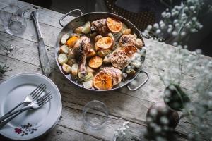 Tender roasted orange chicken marinated in orange juice and soy sauce served with roasted potatoes is a quick and easy dinner recipe everyone will love.