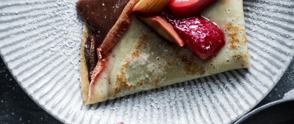 These vanilla crêpes with roasted strawberry rhubarb and homemade chocolate and hazelnut spread are the perfect way to celebrate spring.