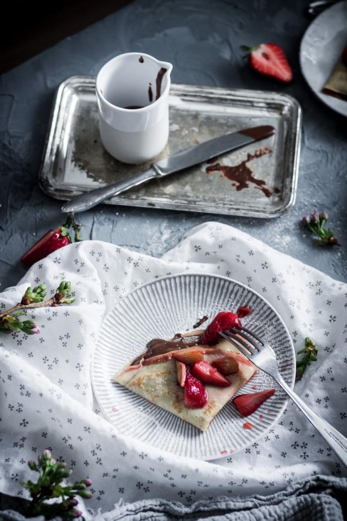 These roasted strawberry rhubarb crêpes with homemade chocolate and hazelnut spread are the perfect way to celebrate spring. 